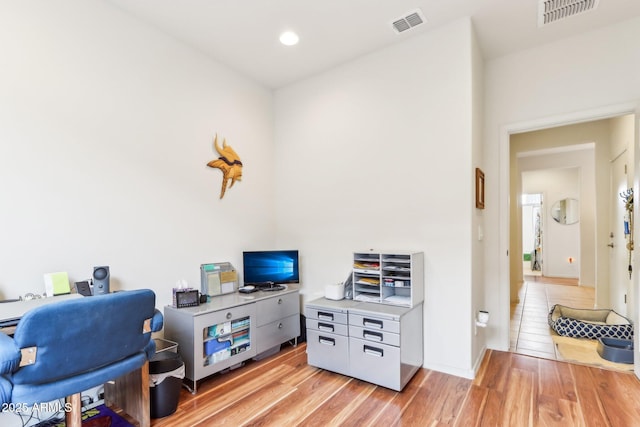 home office featuring recessed lighting, visible vents, and light wood-style flooring