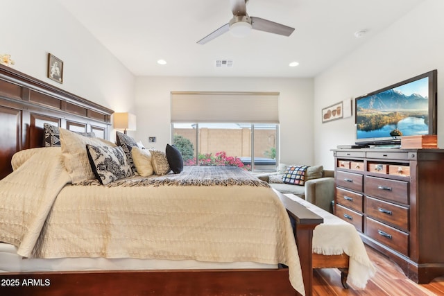 bedroom featuring a ceiling fan, recessed lighting, wood finished floors, and visible vents