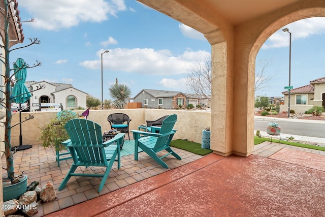 view of patio with a residential view