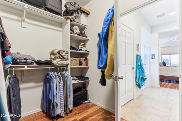 spacious closet with wood finished floors and visible vents