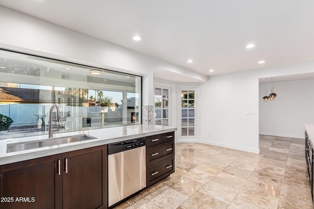6119 E Sandra Ter, Scottsdale, AZ 85254 - kitchen featuring stainless steel dishwasher, a sink, dark brown cabinetry, recessed lighting, and baseboards
