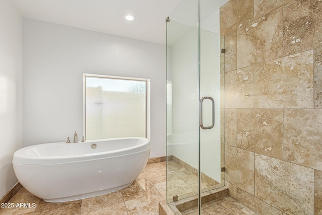 6119 E Sandra Ter, Scottsdale, AZ 85254 - full bath featuring a shower stall, a freestanding bath, baseboards, and recessed lighting