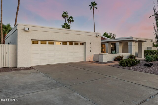 6119 E Sandra Ter, Scottsdale, AZ 85254 - view of front facade with stucco siding and driveway