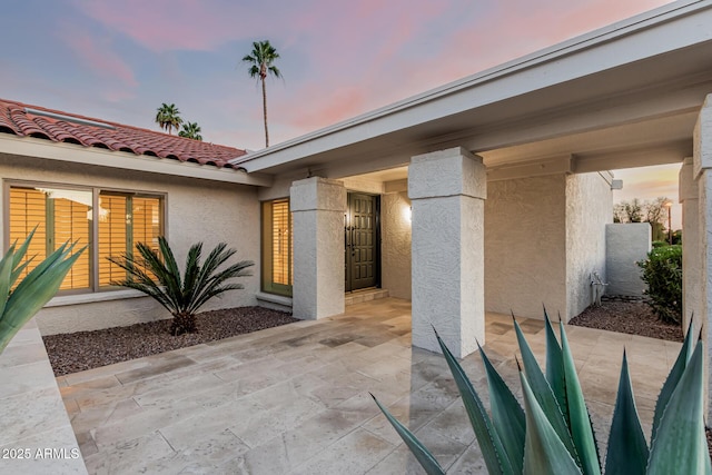 6119 E Sandra Ter, Scottsdale, AZ 85254 - patio terrace at dusk featuring a patio