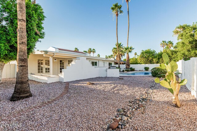 6119 E Sandra Ter, Scottsdale, AZ 85254 - rear view of house featuring stucco siding, a fenced backyard, french doors, and a patio area