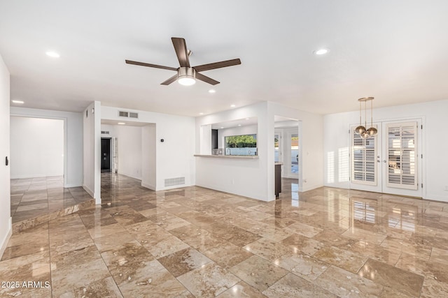6119 E Sandra Ter, Scottsdale, AZ 85254 - unfurnished living room with a ceiling fan, recessed lighting, and baseboards