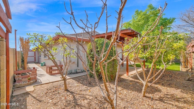 view of yard featuring a patio and fence