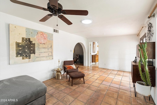 living area with ceiling fan