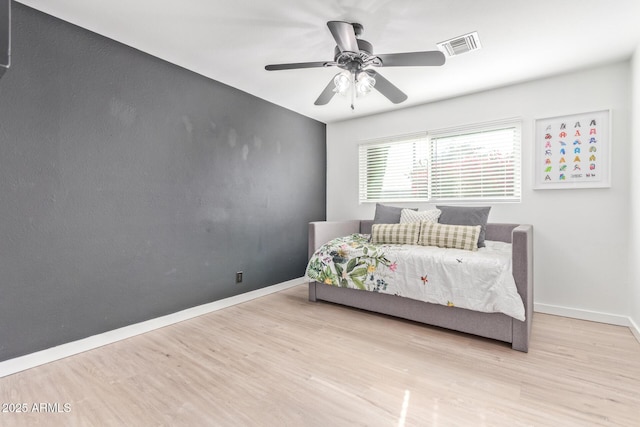 bedroom featuring ceiling fan and light wood-type flooring