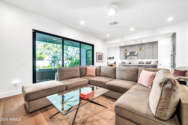 living room with light hardwood / wood-style floors