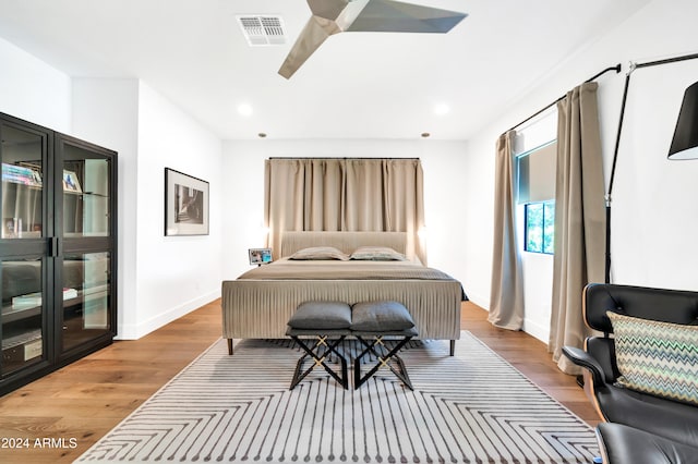 bedroom featuring wood-type flooring and ceiling fan