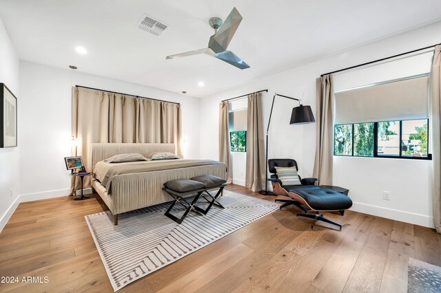 bedroom featuring light wood-type flooring and ceiling fan