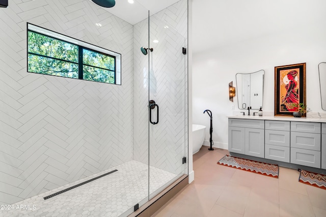 bathroom featuring tile patterned floors, vanity, and plus walk in shower