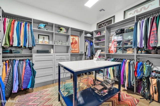 spacious closet featuring light wood-type flooring