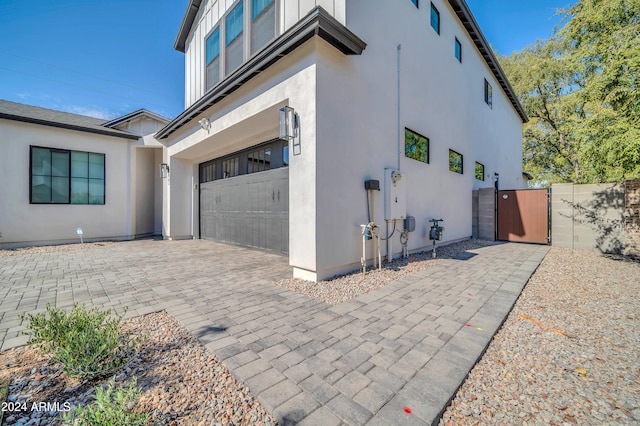 view of side of property with a garage