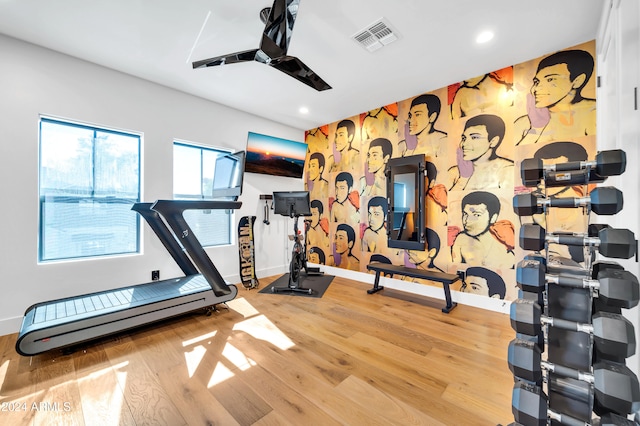 workout area with wood-type flooring