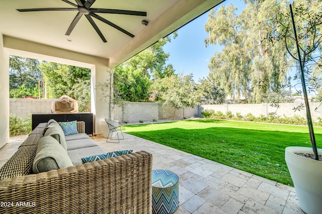 view of patio with outdoor lounge area and ceiling fan