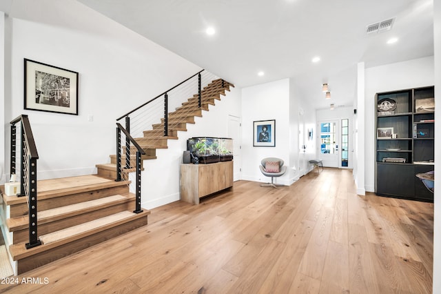 entrance foyer featuring light wood-type flooring and french doors