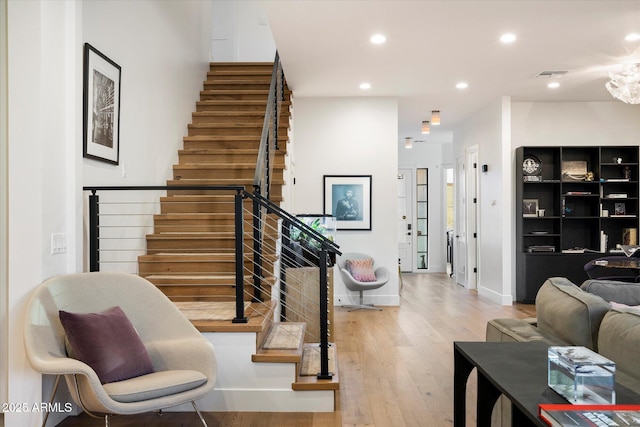 staircase with wood-type flooring