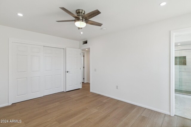 interior space with wood-type flooring and ceiling fan