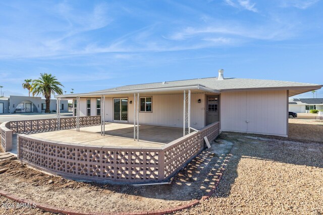 rear view of property featuring a patio area