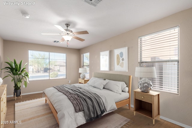 bedroom featuring ceiling fan and hardwood / wood-style flooring