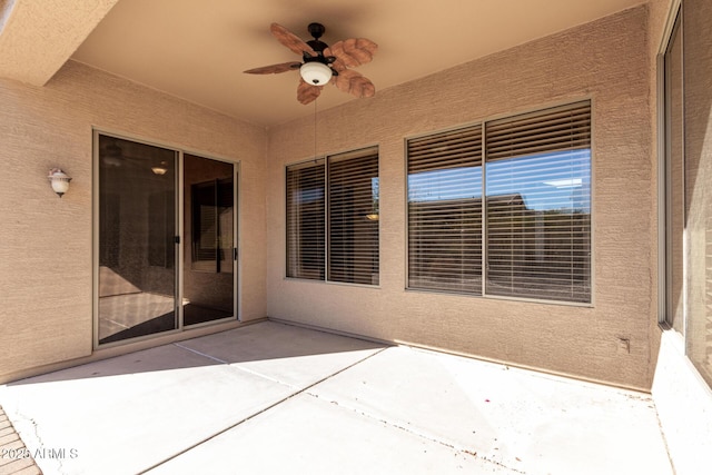 view of patio featuring ceiling fan