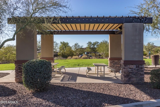 surrounding community with a lawn, a patio area, and a pergola