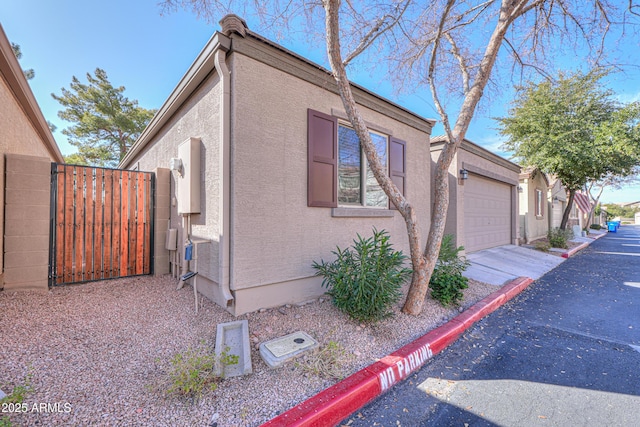 view of side of home with a garage