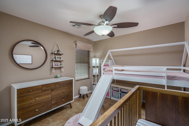 bedroom with ceiling fan and light tile patterned flooring