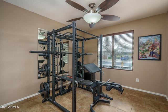 exercise area featuring ceiling fan and tile patterned floors