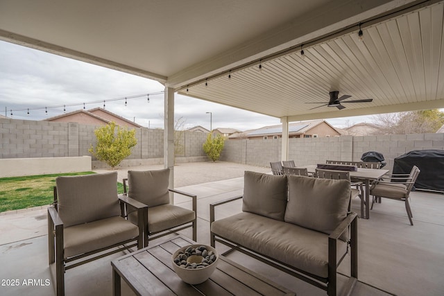 view of patio with grilling area, outdoor lounge area, and ceiling fan