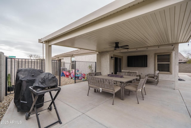 view of patio / terrace with a grill, a playground, and ceiling fan