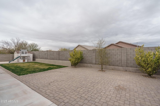 view of patio with a playground