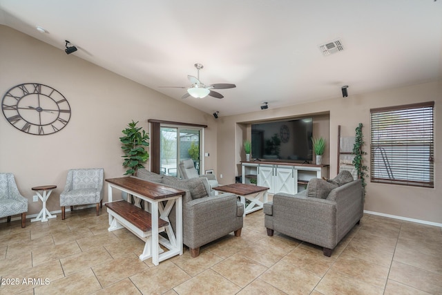 living room with vaulted ceiling, plenty of natural light, light tile patterned flooring, and ceiling fan