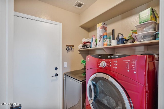 laundry room with washing machine and dryer