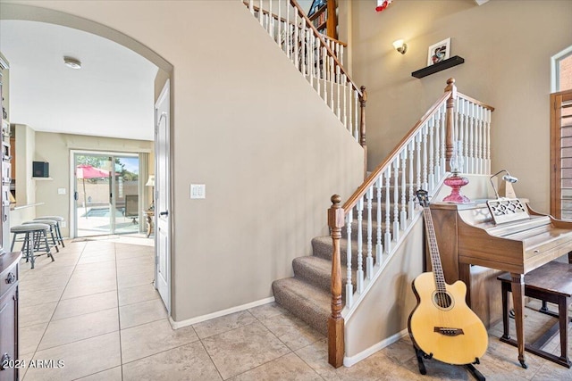 stairway featuring tile patterned floors