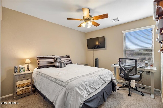 carpeted bedroom with ceiling fan