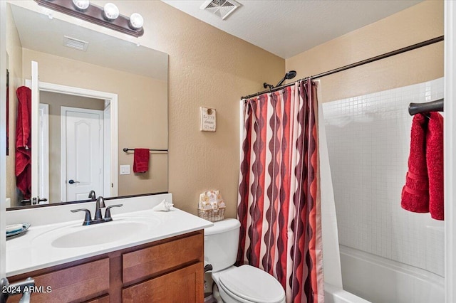 full bathroom featuring a textured ceiling, vanity, toilet, and shower / bathtub combination with curtain