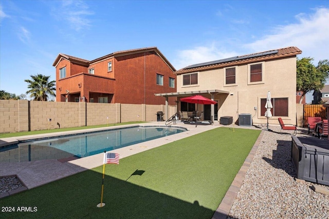 view of swimming pool with a patio and central AC