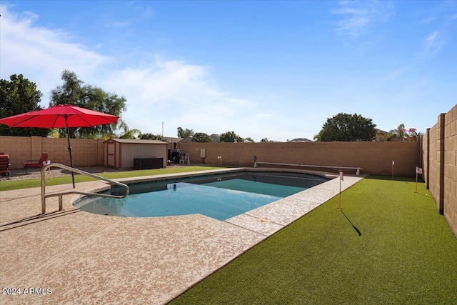 view of swimming pool featuring a storage unit