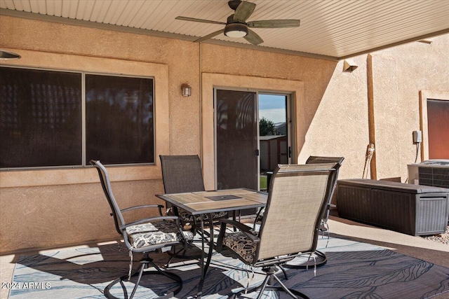 view of patio / terrace with central AC unit and ceiling fan