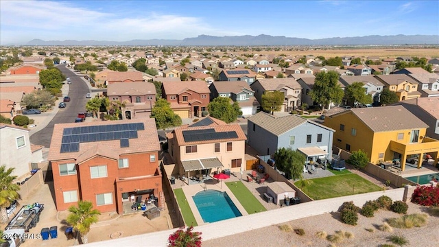 birds eye view of property featuring a mountain view