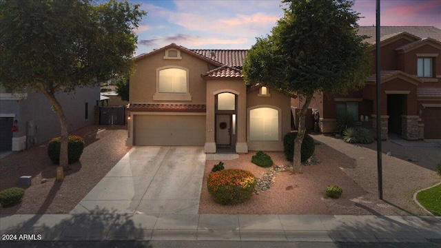 mediterranean / spanish-style house featuring a garage