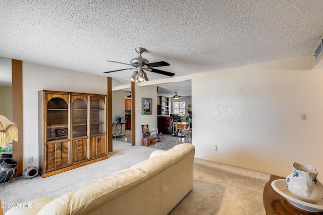 7210 W Caron Dr, Peoria, AZ 85345 - living area with light colored carpet, a ceiling fan, and a textured ceiling