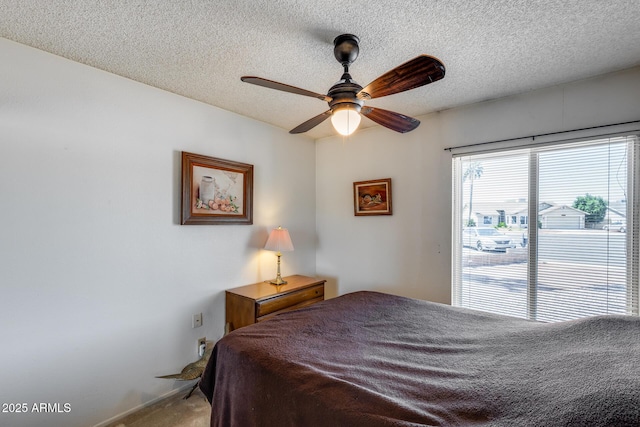 7210 W Caron Dr, Peoria, AZ 85345 - carpeted bedroom featuring a textured ceiling and ceiling fan