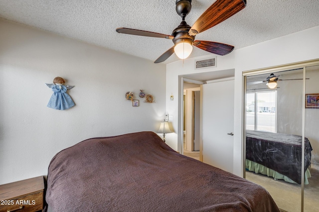 7210 W Caron Dr, Peoria, AZ 85345 - bedroom with a textured ceiling and a ceiling fan