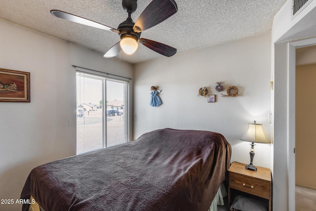 7210 W Caron Dr, Peoria, AZ 85345 - bedroom featuring ceiling fan and a textured ceiling