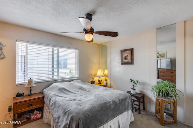 7210 W Caron Dr, Peoria, AZ 85345 - carpeted bedroom with a textured ceiling and a ceiling fan