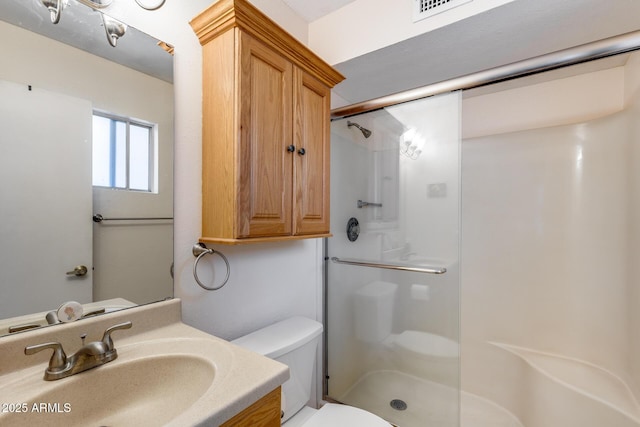 7210 W Caron Dr, Peoria, AZ 85345 - full bath featuring toilet, a stall shower, and vanity